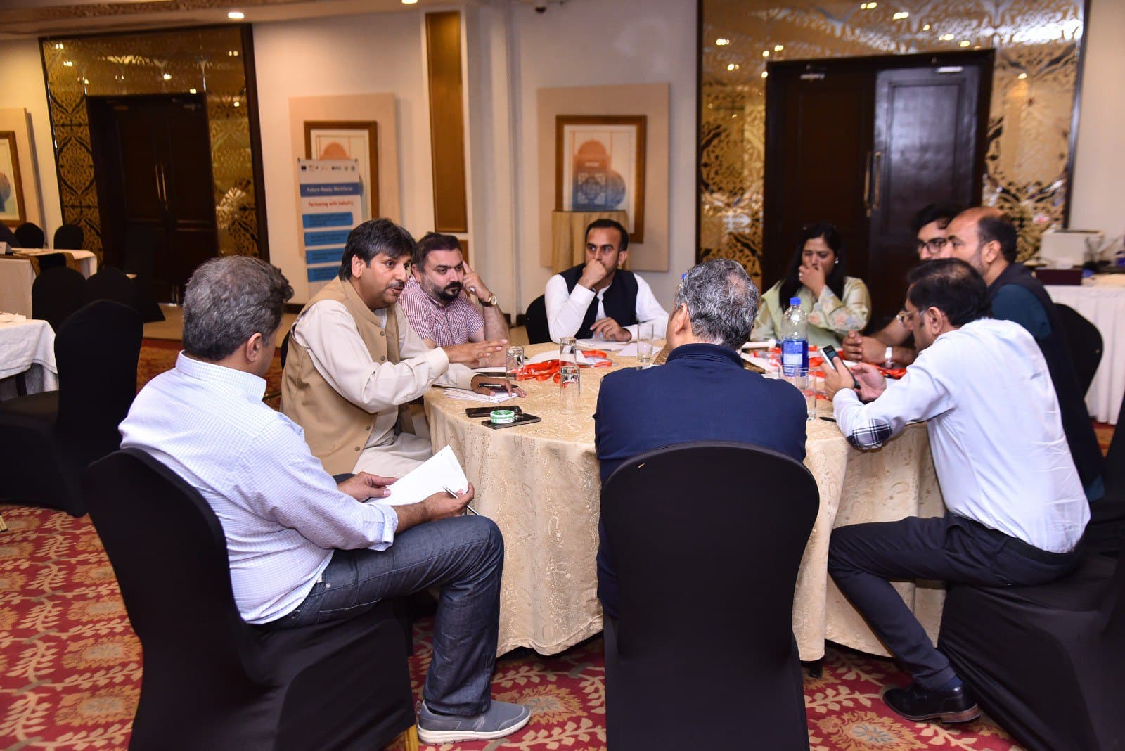 The Shakir & Associates team in a strategy session in Hayatabad, Peshawar